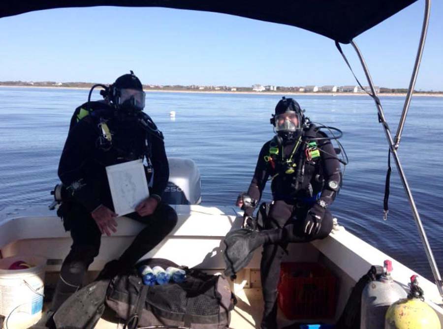 Archaeologist Greg Stratton (right) and ECU grad student Hoyt Alexander prepare to dive on the wreck.