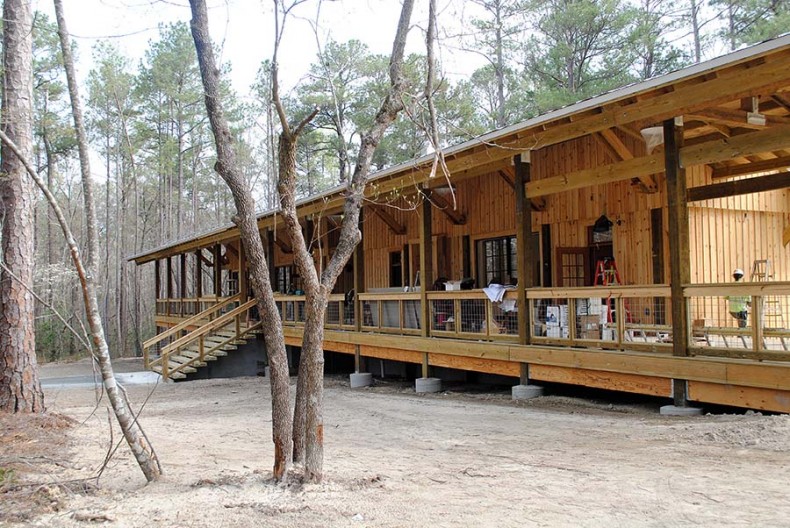 Amish craftsmen raise a building for the 4-H at Millstone Camp