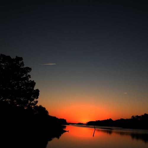 I love my morning walks along the Intracoastal Waterway and the colors of that pre-dawn sky! On this particular morning I was blessed to see the contrails of two flights winging their way north and south. —Allie Lull, Southport, A member of Brunswick Elec