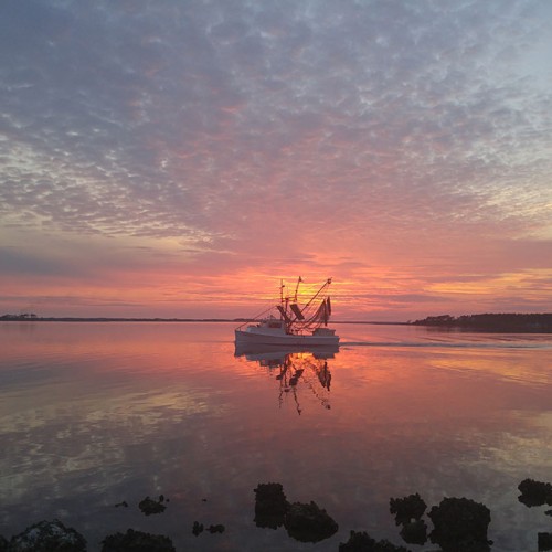 Marshallberg sunset with the Lady Logan. —Cathy Rose, Gloucester, A member of Carteret-Craven Electric Cooperative