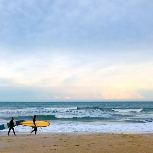 Two surfers leaving Wrightsville Beach after a day of surfing in late fall. —Janet Beal, Leland, Brunswick Electric