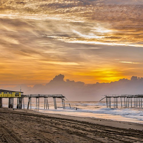 The bygone Frisco Pier was captured at sunrise on a cool March morning along the vast Outer Banks beaches. Taking these photos preserves history and rejuvenates the memories her visitors. —Kenneth Newman, Prince George, VA, Cape Hatteras Electric