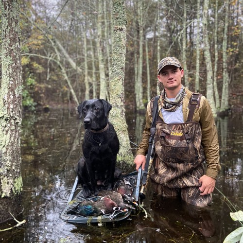 A picture of my son and his lab, duck hunting in Anson County. —Tega Taylor, Lilesville 