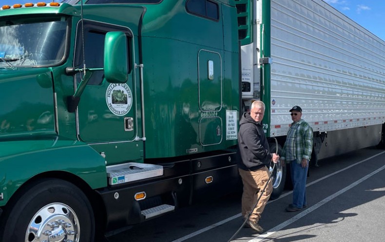 (Left to right) Hollar and Greene Produce Plant Manager Eric Baker with driver Bruce Church.