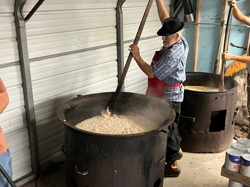 Mr. George stirring the big pot