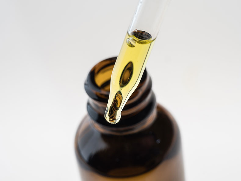 Container with CBD oil