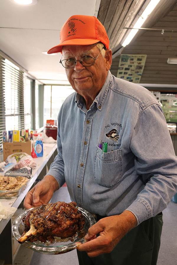Meat guru Bill Faust holds venison ham.
