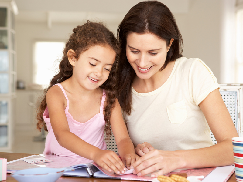 Mother, daughter scrapbooking