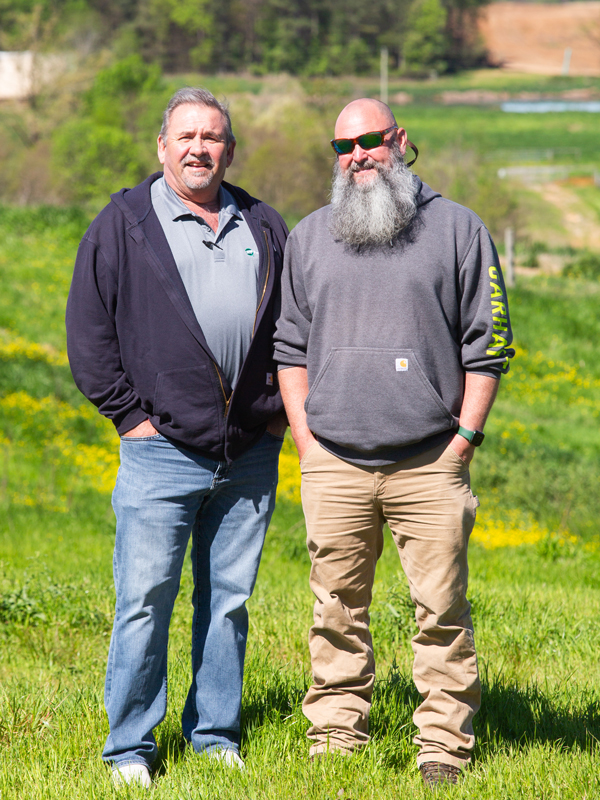 Pee Dee Electric Energy Use Advisor Todd Moore (left) with White Rock Farms owner Roddy Purser.